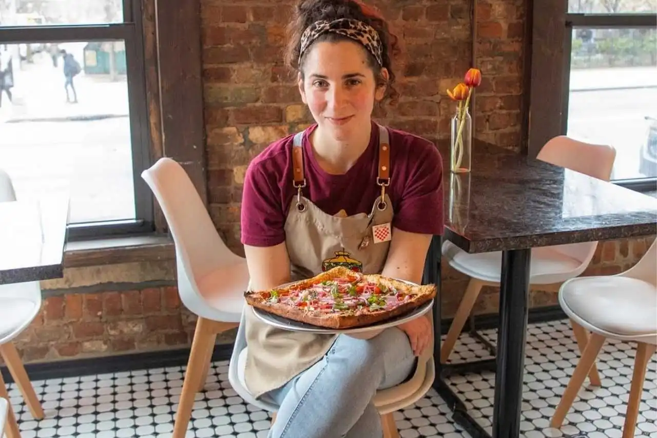 person eating pizza