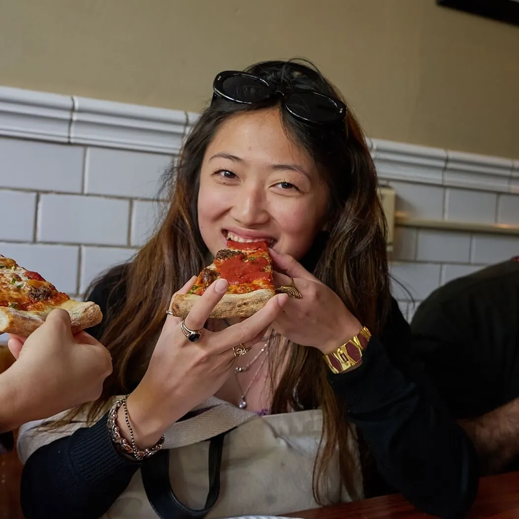 person eating pizza