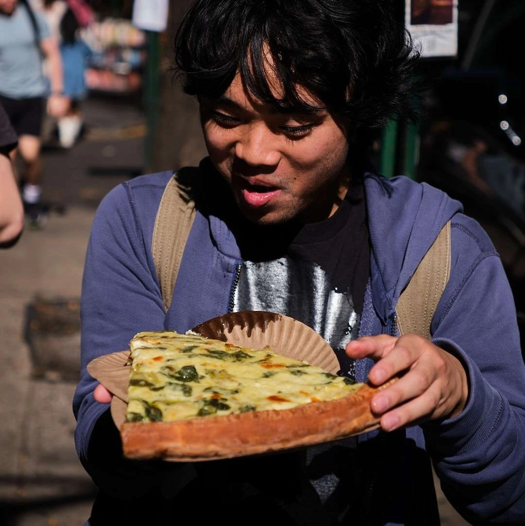 person eating pizza
